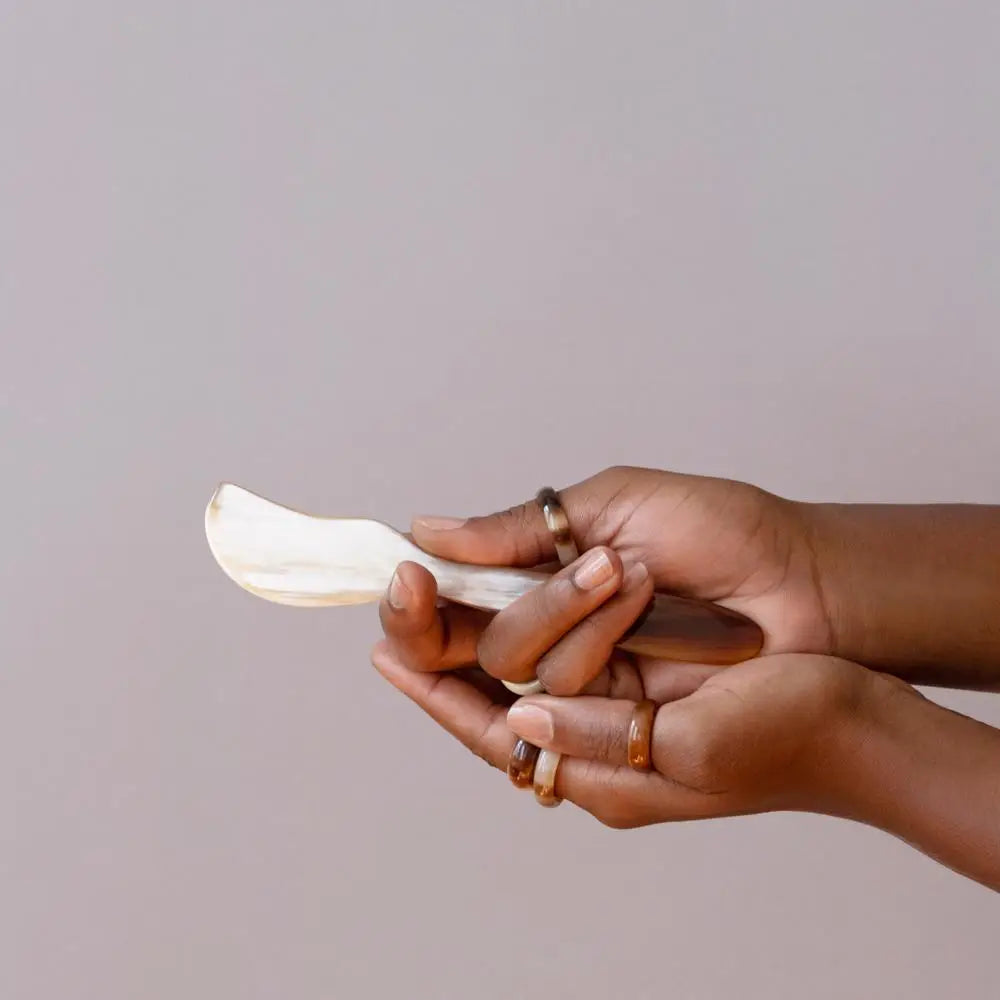 fair Trade Handcrafted butter spreader with hands